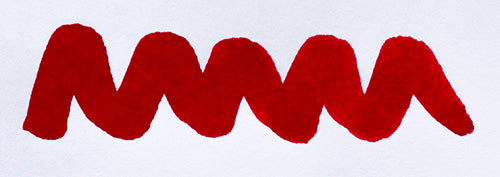 Wavy red line on a white background. Diamine Carnival fountain pen ink colour swatch.