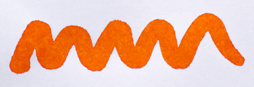 Wavy orange line on a white background. Diamine Blaze Orange fountain pen ink colour swatch.