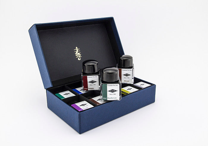 Set of 10 Diamine fountain pen ink bottles in an open blue gift set box on a white background.