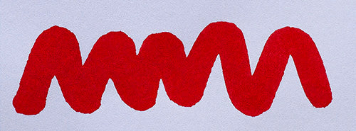 Wavy red line on a white background. Diamine Tulip fountain pen ink colour swatch.
