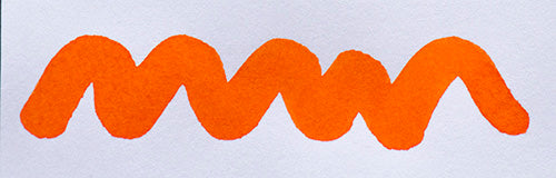 Wavy orange line on a white background. Diamine Orange fountain pen ink colour swatch.