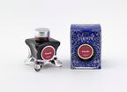 Diamine Poinsettia fountain pen ink bottle and packaging on a white background.