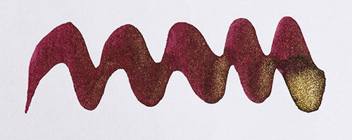 Wavy burgundy line on a white background. Diamine Wine Divine fountain pen ink colour swatch.