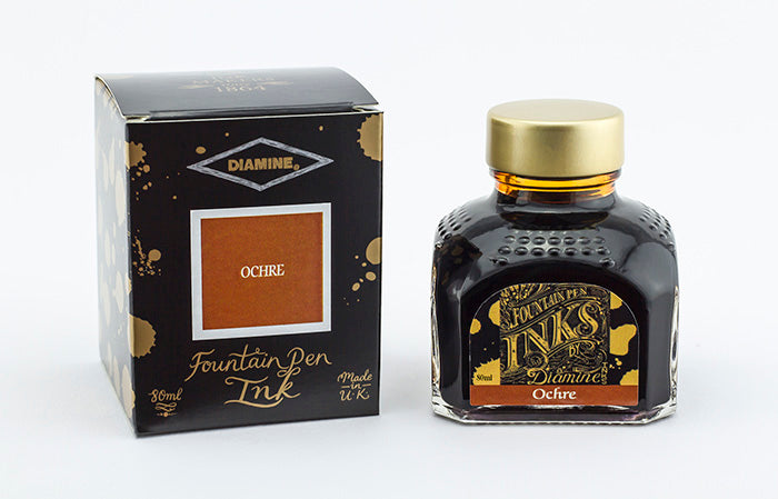 Diamine Ochre fountain pen ink bottle and packaging on a white background.