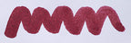 Wavy purple line on a white background. Diamine Tyrian Purple fountain pen ink colour swatch.