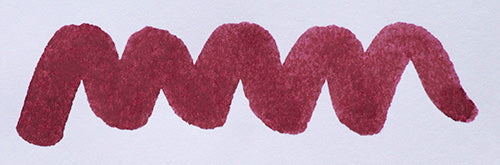 Wavy purple line on a white background. Diamine Tyrian Purple fountain pen ink colour swatch.