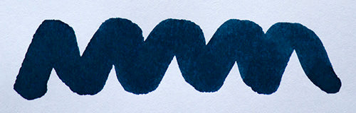 Wavy blue line on a white background. Diamine Oxford Blue fountain pen ink colour swatch.