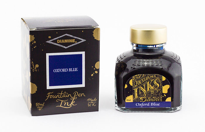 Diamine Oxford Blue fountain pen ink bottle and packaging on a white background.