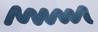 Wavy blue line on a white background. Diamine Prussian Blue fountain pen ink colour swatch.