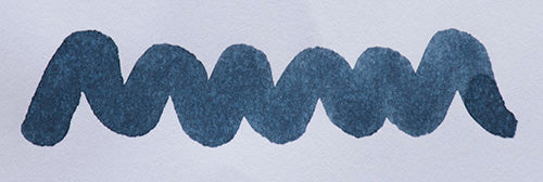 Wavy blue line on a white background. Diamine Prussian Blue fountain pen ink colour swatch.