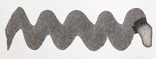Wavy grey line on a white background. Diamine Moon Dust fountain pen ink colour swatch.