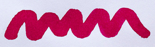Wavy pink line on a white background. Diamine Claret fountain pen ink colour swatch.