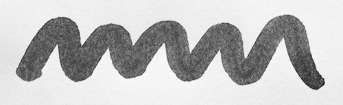 Wavy grey line on a white background. Diamine Grey fountain pen ink colour swatch.