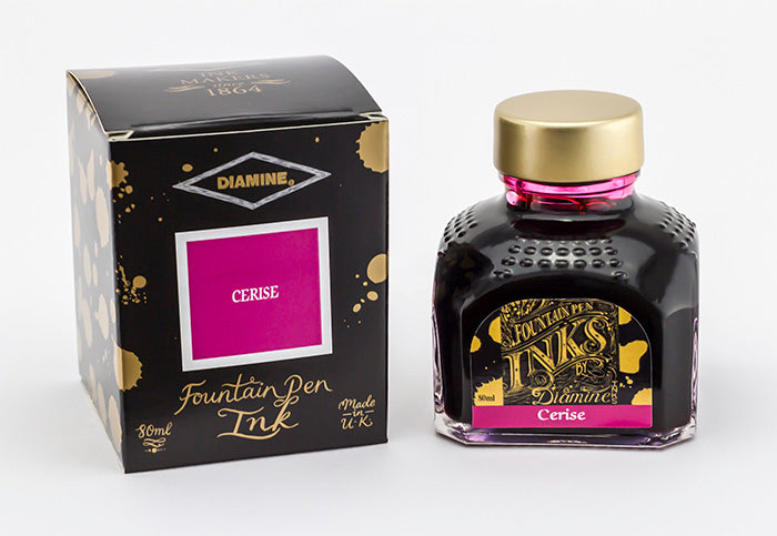 Diamine Cerise fountain pen ink bottle and packaging on a white background.