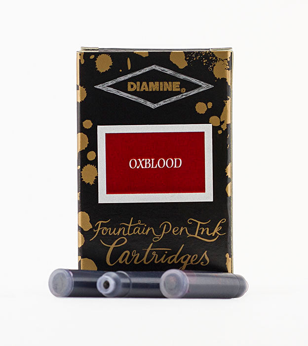 Diamine Oxblood fountain pen ink cartridges and packaging box on a white background.