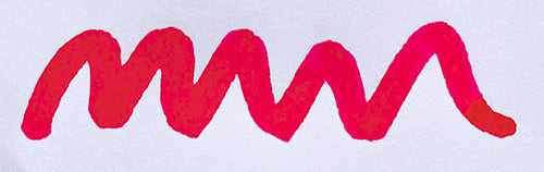 Wavy pink line on a white background. Diamine Cerise fountain pen ink colour swatch.