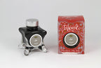Diamine Ash fountain pen ink bottle and packaging on a white background.