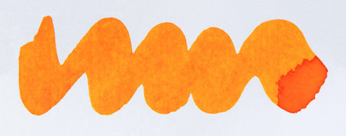 Wavy orange line on a white background. Diamine Wonderland fountain pen ink colour swatch.