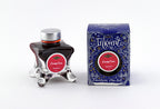 Diamine Candy Cane fountain pen ink bottle and packaging on a white background.