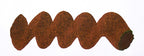 Wavy brown line on a white background. Diamine Pick Me Up fountain pen ink colour swatch.