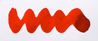 Wavy red line on a white background. Diamine Cardinal fountain pen ink colour swatch.