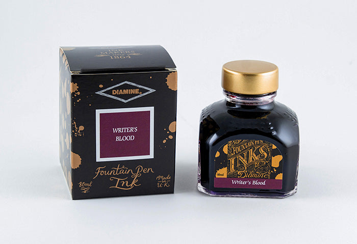 Diamine Writers Blood fountain pen ink bottle and packaging on a white background.