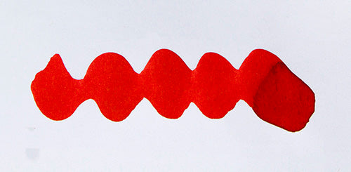 Wavy red line on a white background. Diamine Ho Ho Ho fountain pen ink colour swatch.