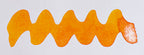Wavy yellow line on a white background. Diamine Citrus Ice fountain pen ink colour swatch.