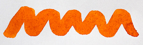 Wavy orange line on a white background. Diamine Golden Honey  fountain pen ink colour swatch.