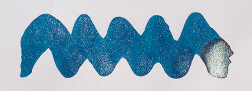 Wavy blue line on a white background. Diamine Starlit Sea fountain pen ink colour swatch.