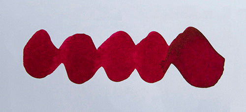 Wavy pink line on a white background. Diamine Poinsettia fountain pen ink colour swatch.