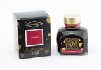 Diamine Crimson fountain pen ink bottle and packaging on a white background.