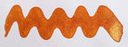 Wavy brown line on a white background. Diamine Caramel Sparkle fountain pen ink colour swatch.