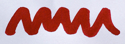 Wavy red line on a white background. Diamine Crimson fountain pen ink colour swatch.