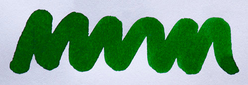 Wavy green line on a white background. Diamine Emerald fountain pen ink colour swatch.