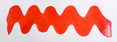 Wavy red line on a white background. Diamine Firestorm Red fountain pen ink colour swatch.