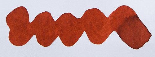 Wavy orange red line on a white background. Diamine Red Robin fountain pen ink colour swatch.