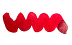 Wavy red line on a white background. Diamine Tinsel fountain pen ink colour swatch.