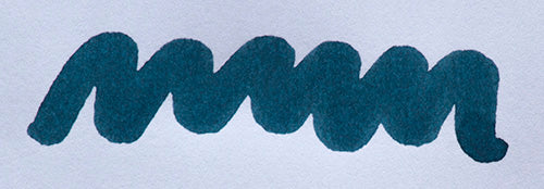 Wavy blue line on a white background. Diamine Indigo fountain pen ink colour swatch.