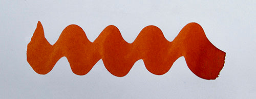 Wavy orange line on a white background. Diamine Fire Embers fountain pen ink colour swatch.