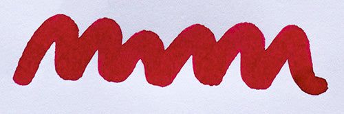 Wavy red line on a white background. Diamine Maroon fountain pen ink colour swatch.