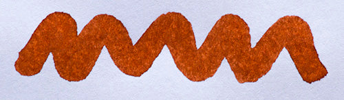Wavy brown line on a white background. Diamine Burnt Sienna fountain pen ink colour swatch.