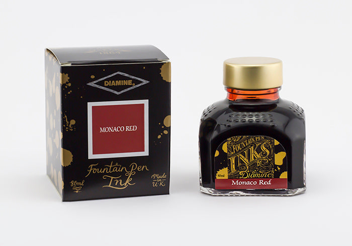 Diamine Monaco Red fountain pen ink bottle and packaging on a white background.