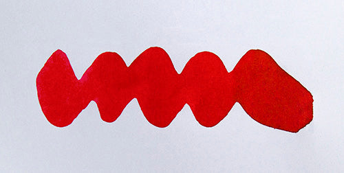 Wavy red line on a white background. Diamine Candy Cane fountain pen ink colour swatch.