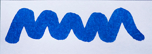Wavy blue line on a white background. Diamine Aster fountain pen ink colour swatch.