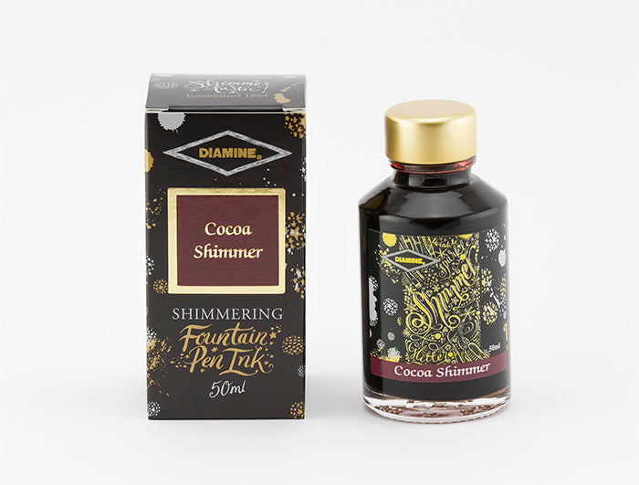 Diamine Cocoa Shimmer fountain pen ink bottle and packaging on a white background.