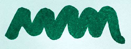 Wavy green line on a white background. Diamine Schubert fountain pen ink colour swatch.