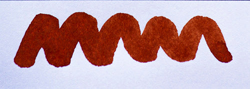 Wavy brown line on a white background. Diamine Terracotta fountain pen ink colour swatch.