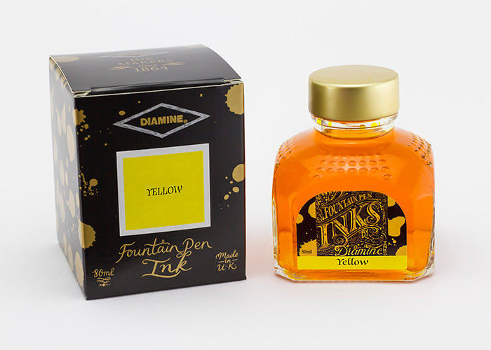 Diamine Yellow fountain pen ink bottle and packaging on a white background.