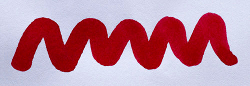 Wavy red line on a white background. Diamine Classic Red fountain pen ink colour swatch.